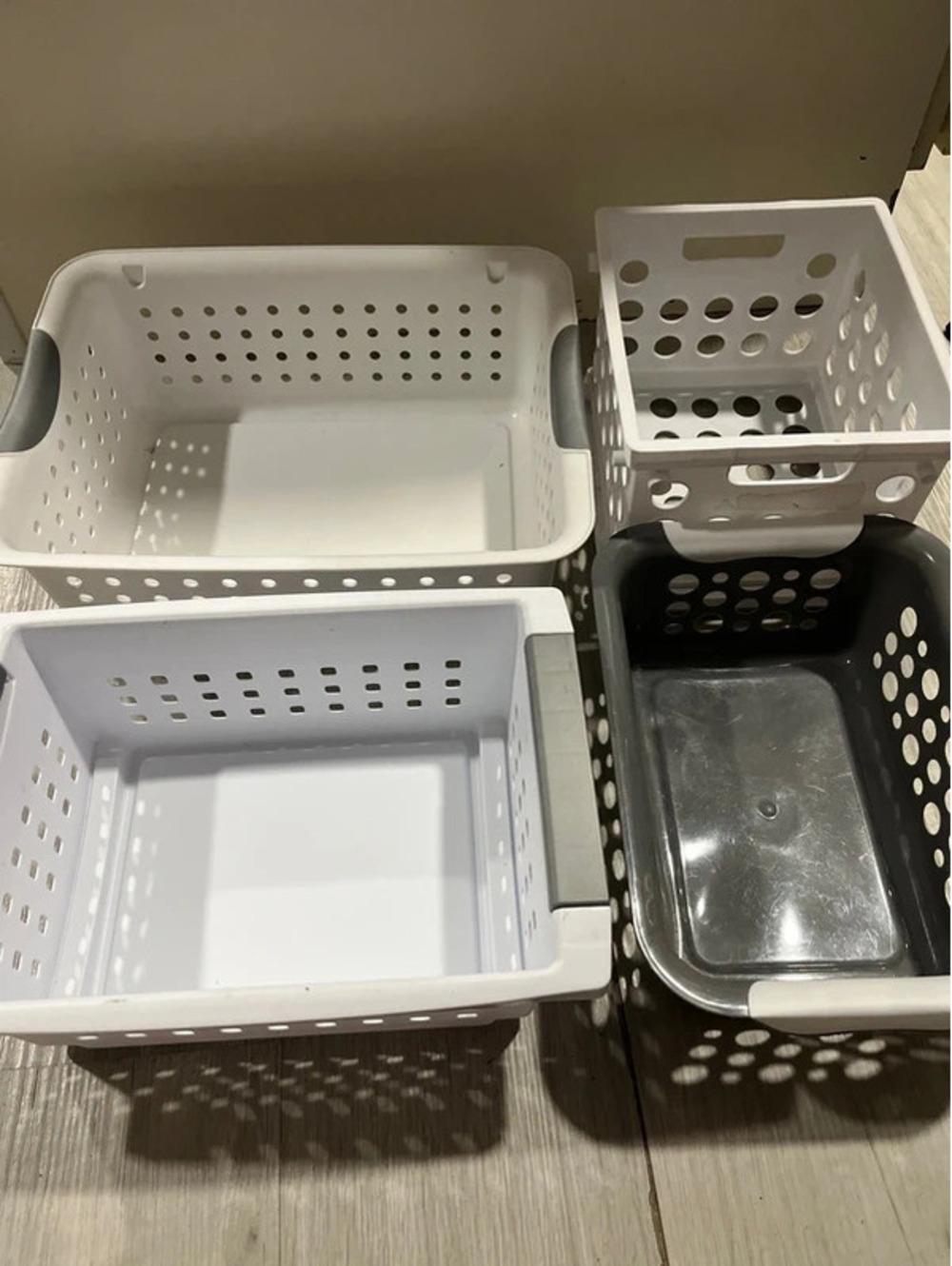 4 plastic organizing baskets storage